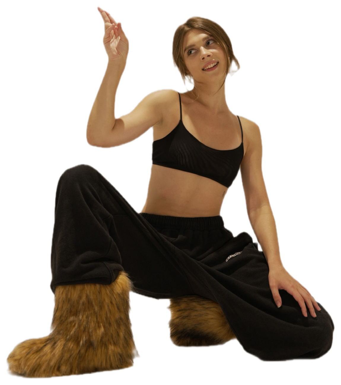 Sofya sitting on the studio floor, pointing up at the Write to me button
